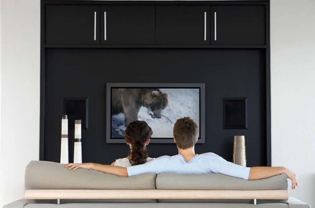 couple watching tv for at home date night ideas