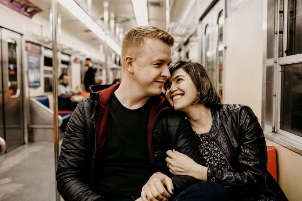 Teenage couple on a subway ride for their date