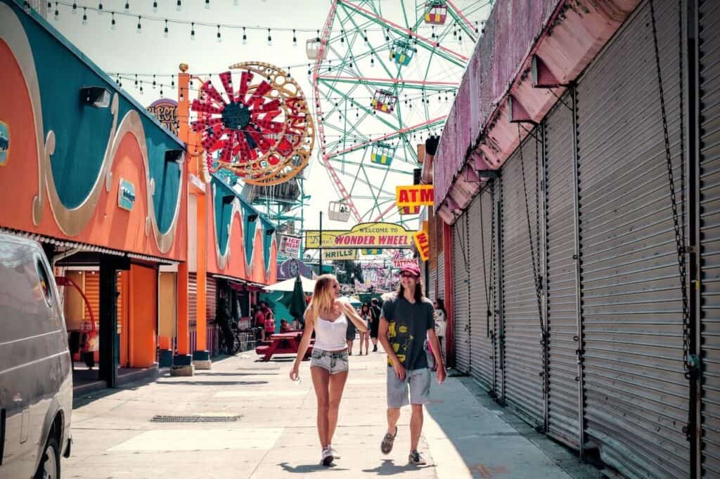 couple walking around at a carnival for an outdoor date idea