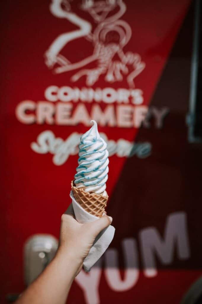 large ice cream cone in front of food truck