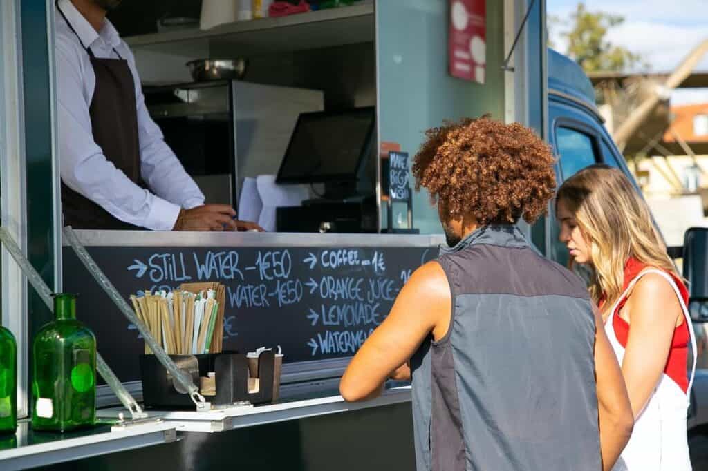 couple ordering from a food truck