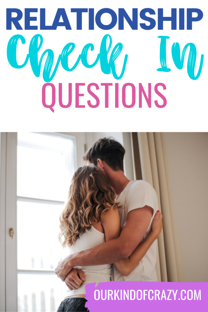 image reads "relationship check in questions" with couple hugging and looking out a glass door.
