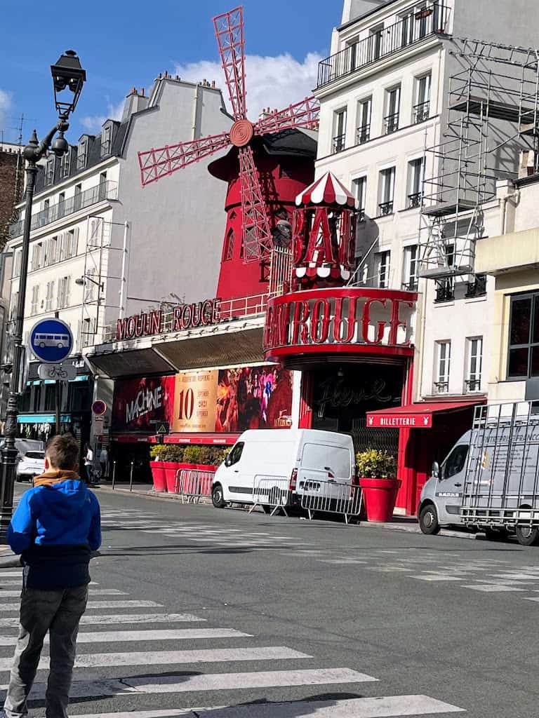 Moulin Rouge windmill and outside of building. 